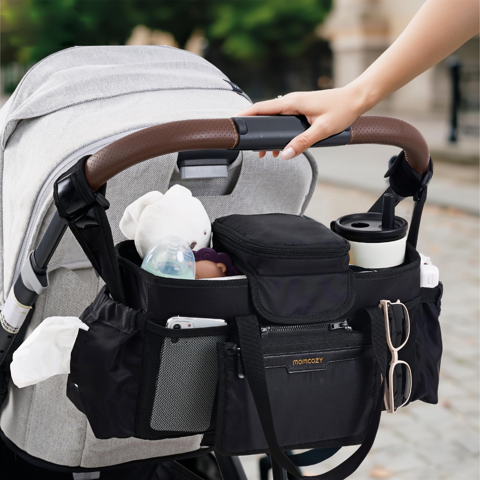 Momcozy Extra Large Stroller Organizer Max mesh pocket for phone and tissues.