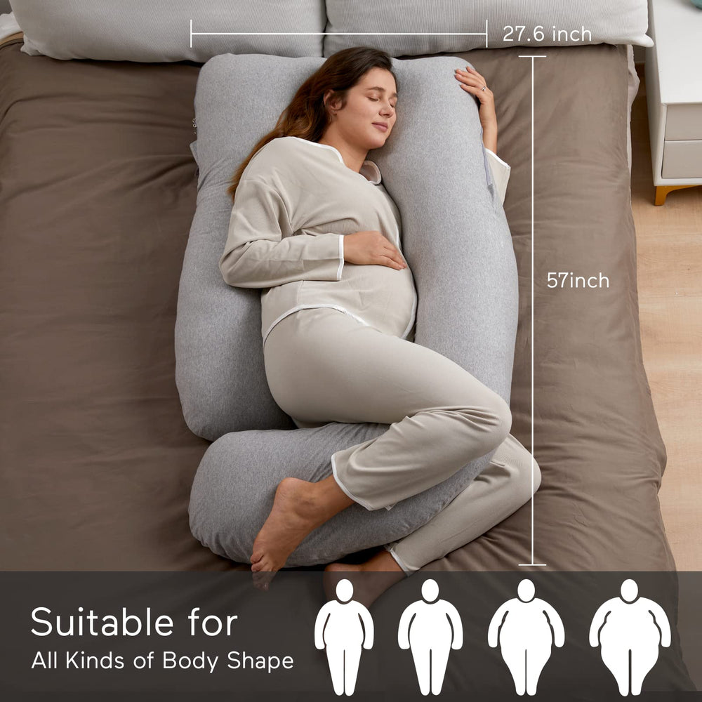 Momcozy pillow used in bed for reading or watching TV with ergonomic full-length support.