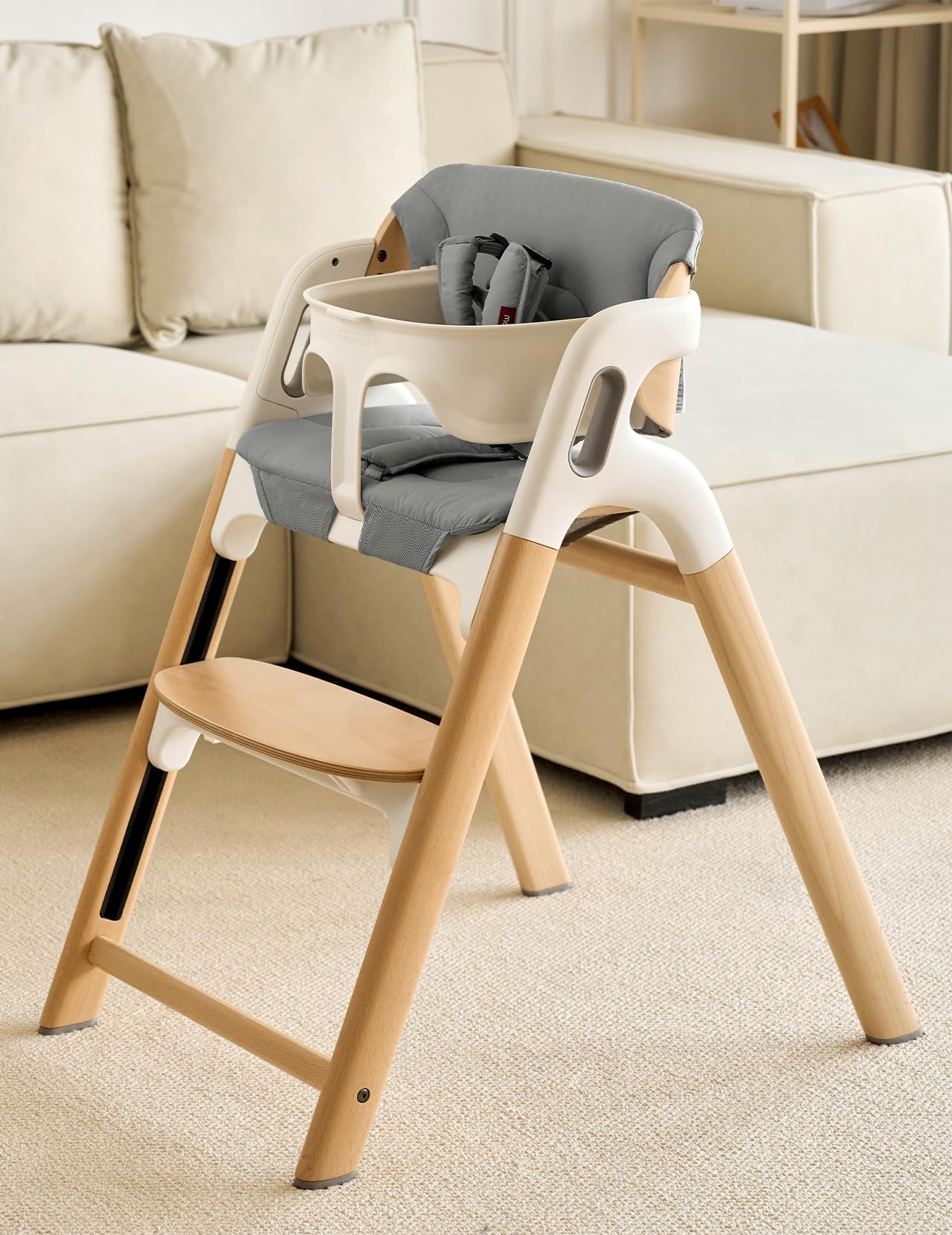 Momcozy high chair cushion backrest detail highlighting added lumbar support