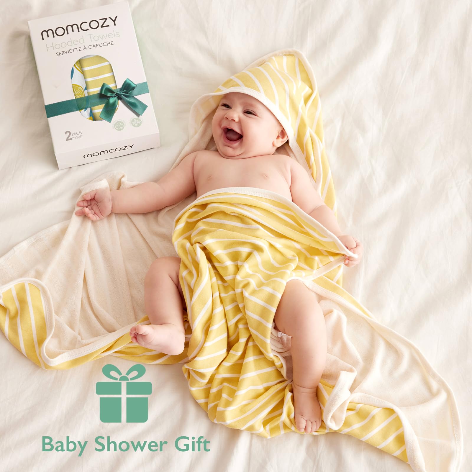 Momcozy Hooded Baby Towel Lemon Leaves absorption test demonstrates quick moisture pickup.