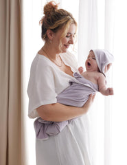 Momcozy 28x28 hooded towel keeps baby wrapped and cozy