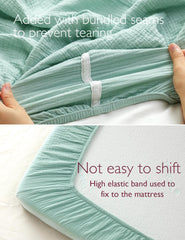 Momcozy crib sheet green grey is breathable and moisture absorbent
