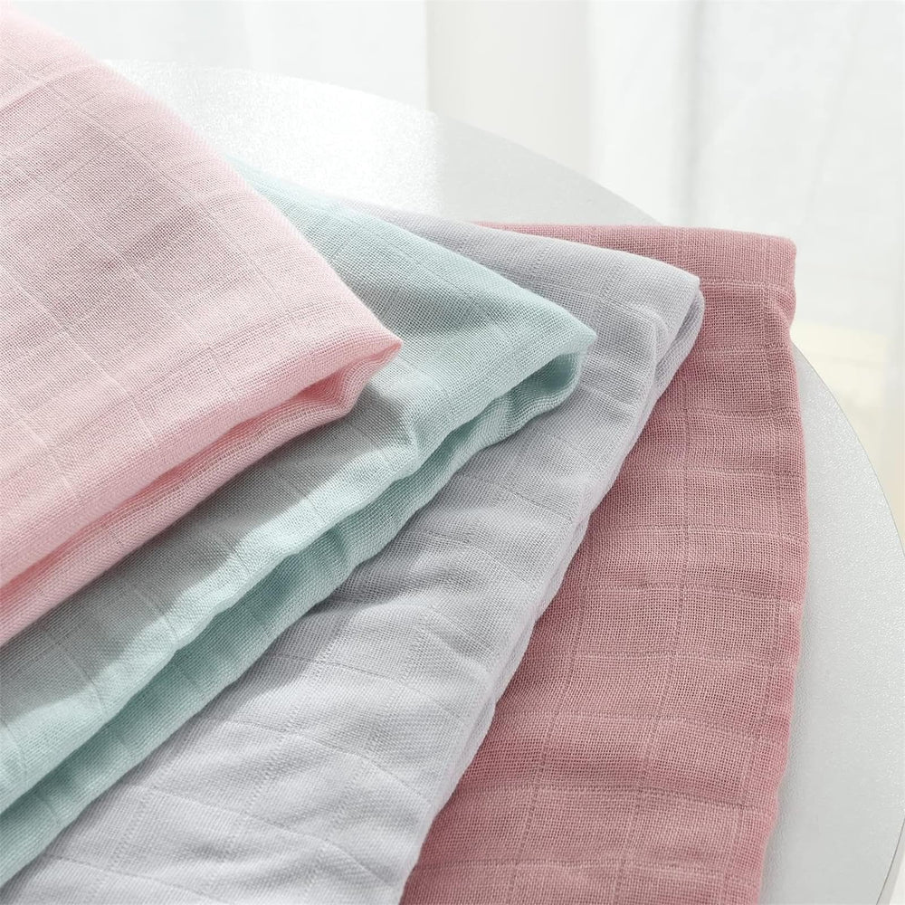 Momcozy swaddle laid flat as baby blanket for nap.