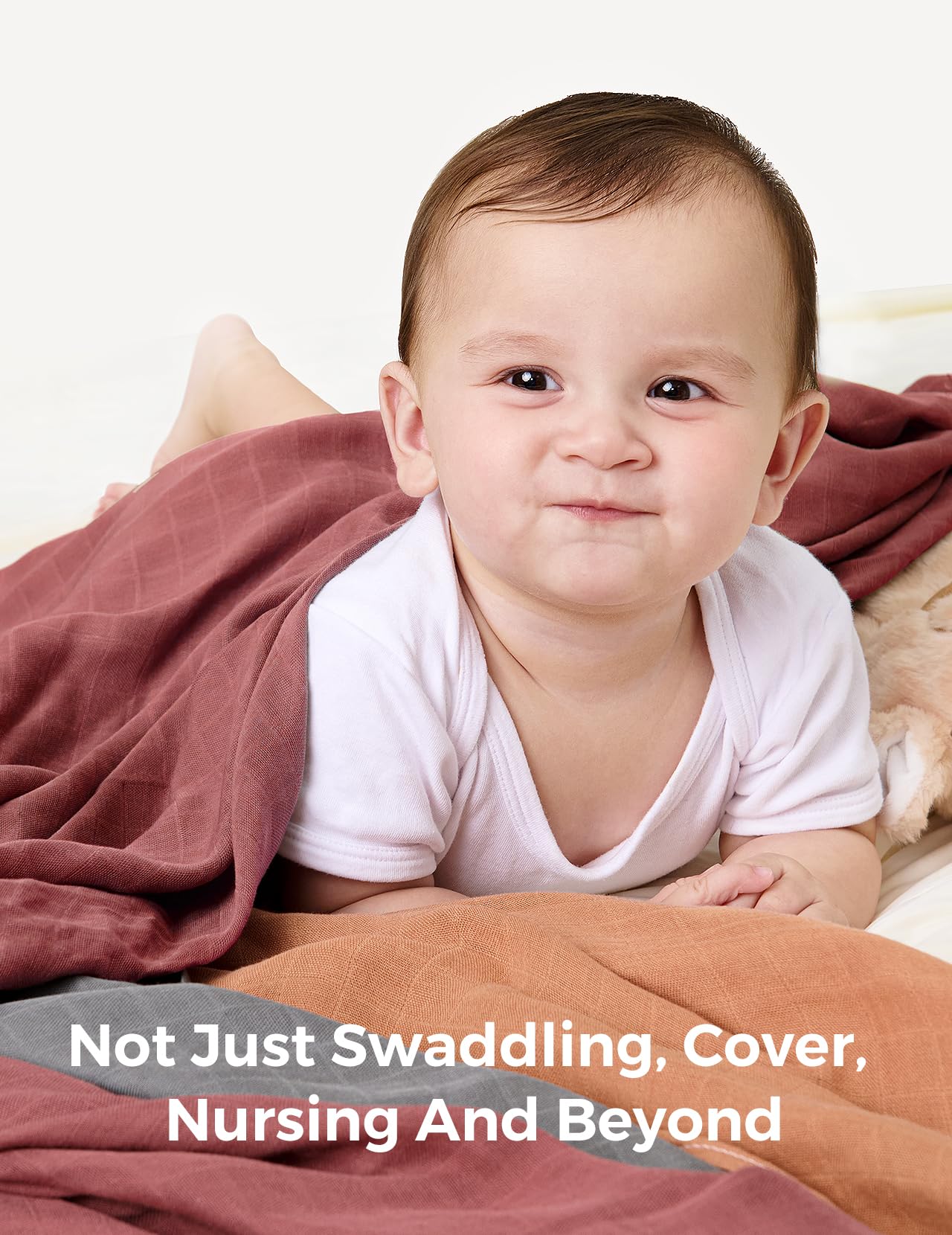 Momcozy muslin blanket used as burp cloth and change pad