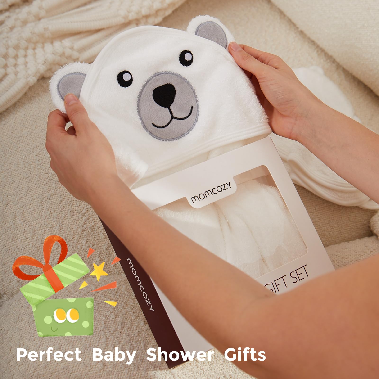 Size-friendly towel set for newborns to toddlers with Momcozy branding.