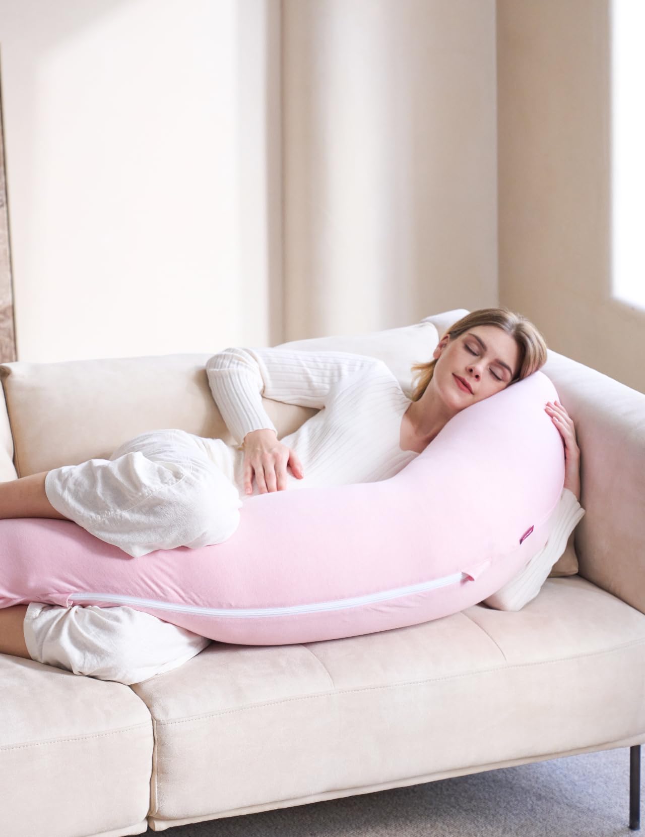 Momcozy pink pillow close-up with double-zipper cover