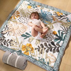 Momcozy Forest World play mat laid flat for tummy time and safe play.