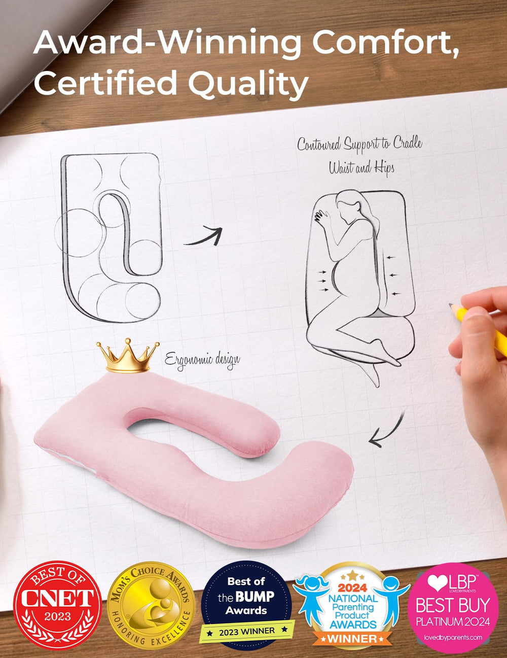 Momcozy pink pillow supports hips and knees during lounging.