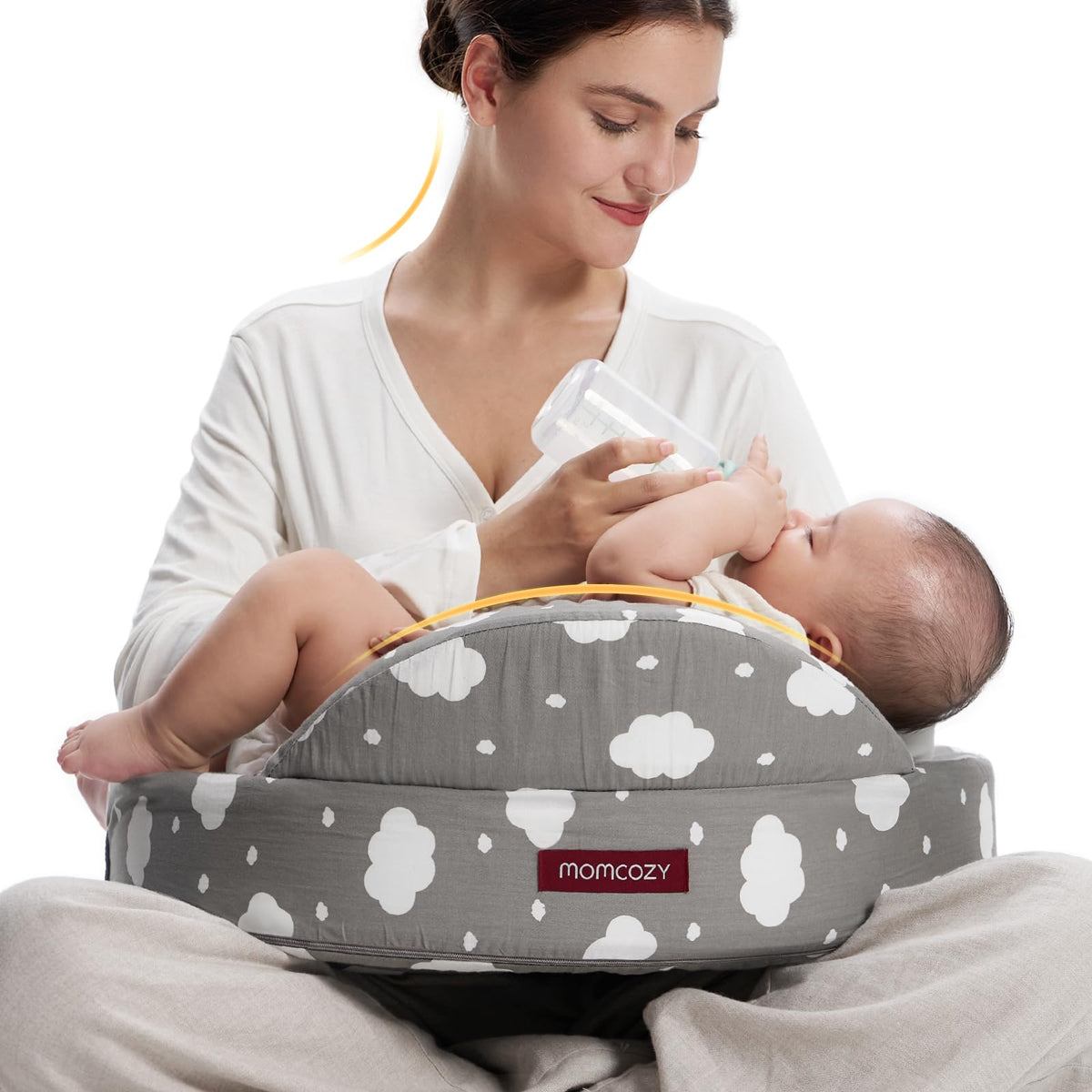 Momcozy Safety Guard Nursing Pillow cradling baby for secure latch and hands-free feeding
