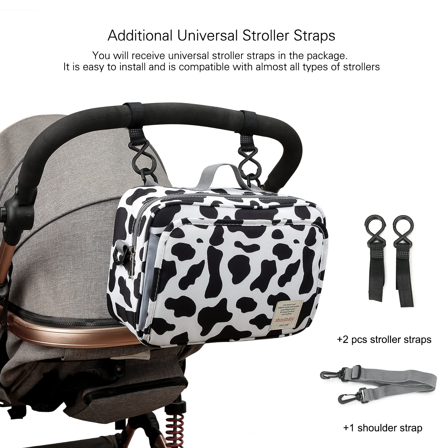 MOMIGO cow print diaper caddy with durable hand strap for daily use.