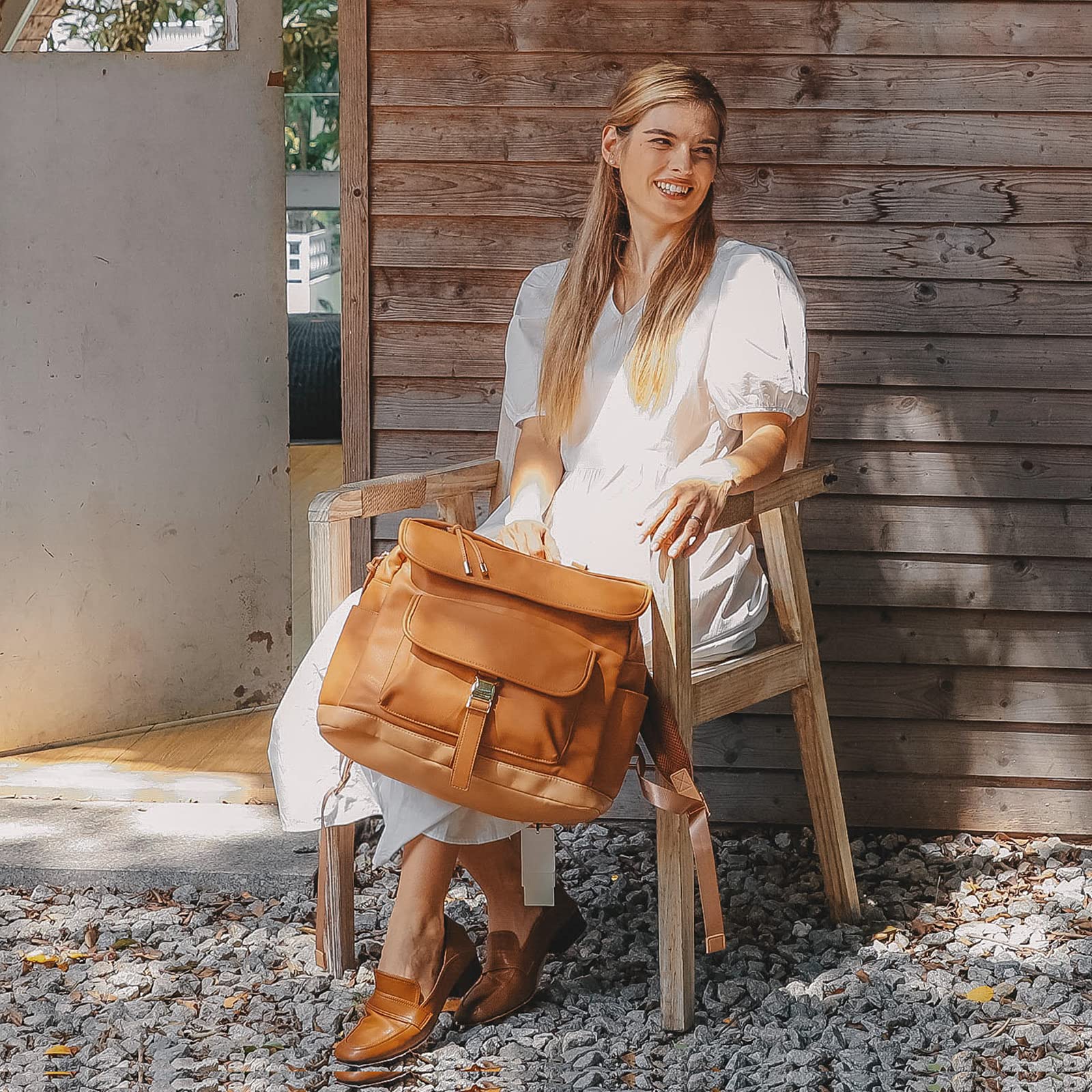 MOMINSIDE leather diaper bag backpack durable brown finish and easy to clean surface.