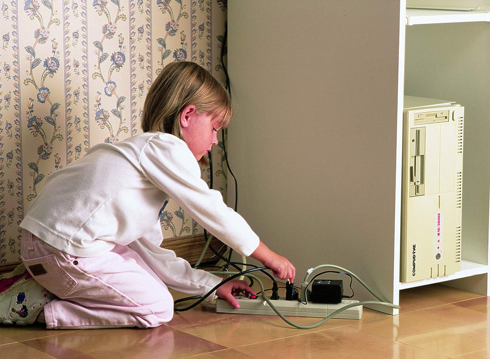 Two nylon cord keepers from Mommy's Helper organize cords for a tidy setup.