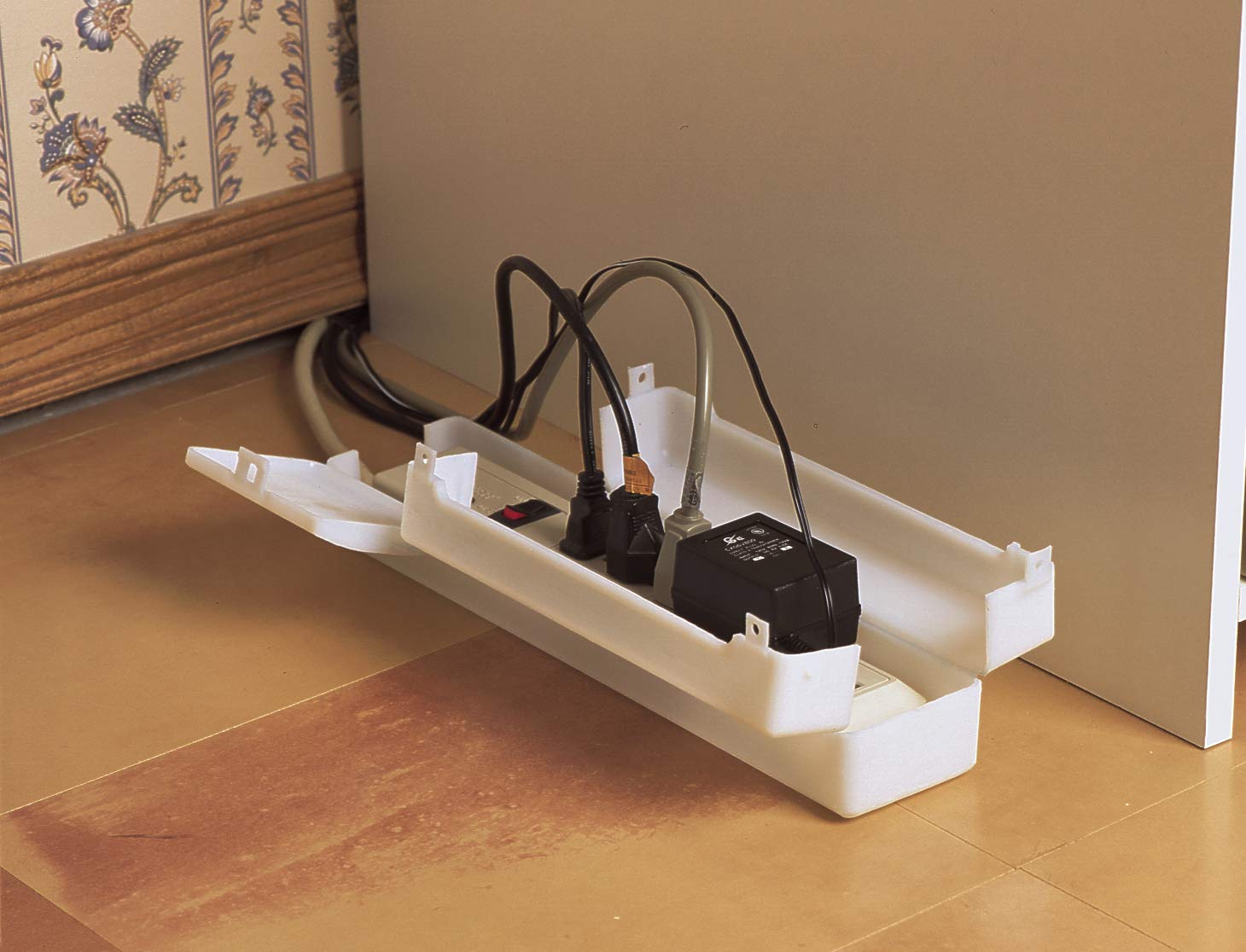 Closed latch demonstrates secure childproofing for outlets with the Mommy's Helper cover.