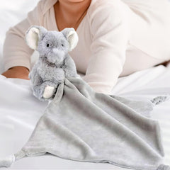MON AMI Ozzy plush lovey used as a crib accessory for calming cuddles.