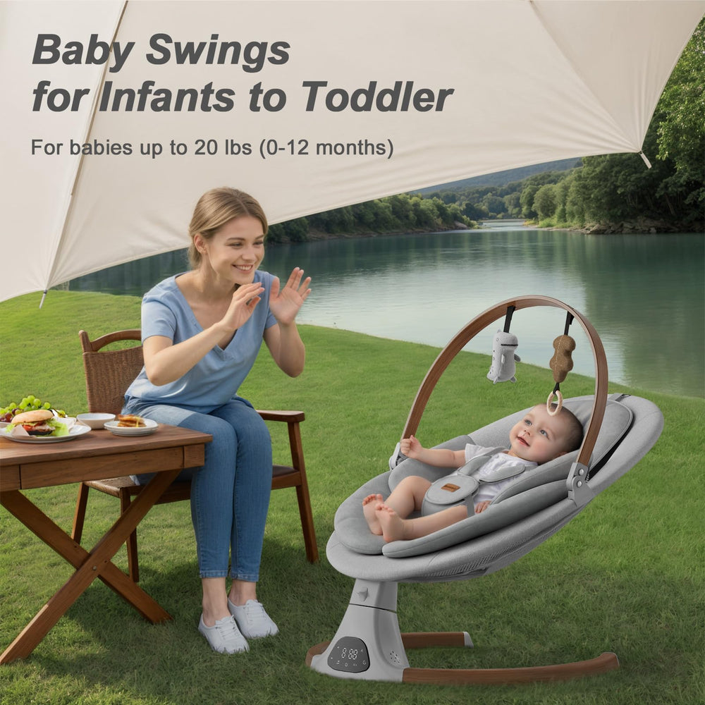 Monamii light-grey fabric swing with secure 5-point harness and plush padding.