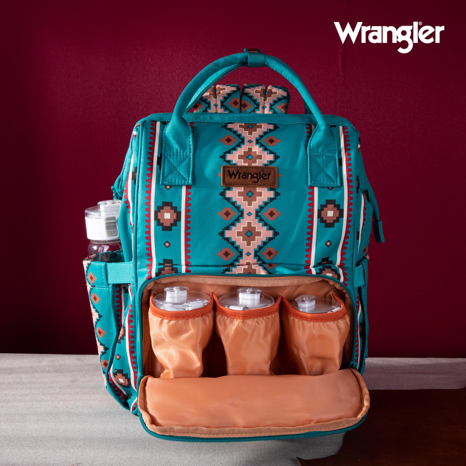 Back compartment of Montana West Wrangler diaper bag open for easy access