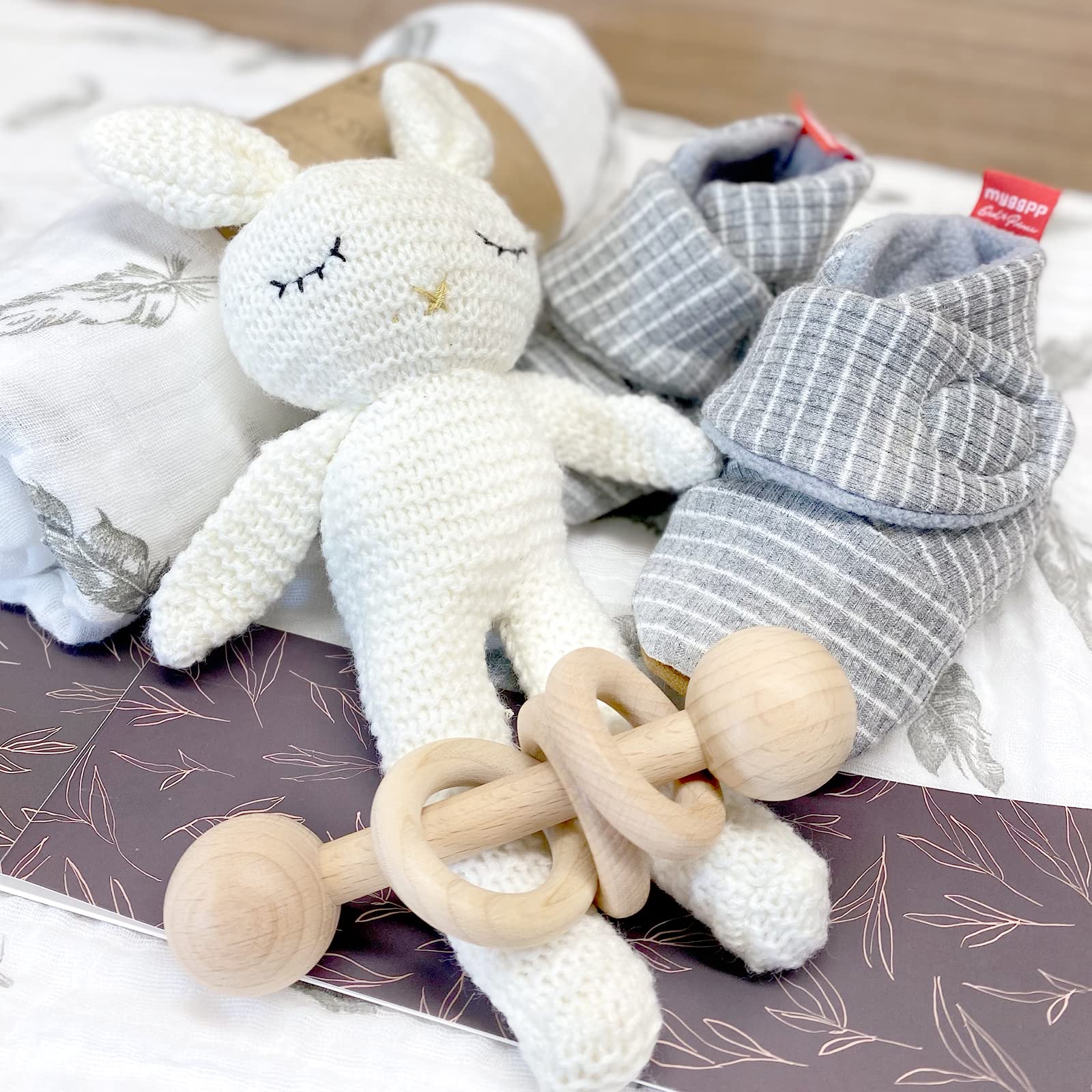 Moody Park baby gift basket booties with vegan leather soles keep tiny feet warm.