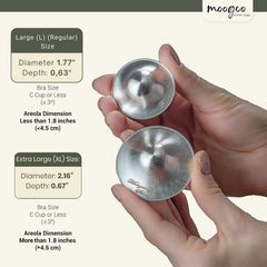 MOOGCO silver nipple cups closeup mirror finish, highlighting durable, premium shielding for daily nursing.