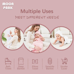 MOON PARK baby wrapped in towel after bath displaying hooded warmth