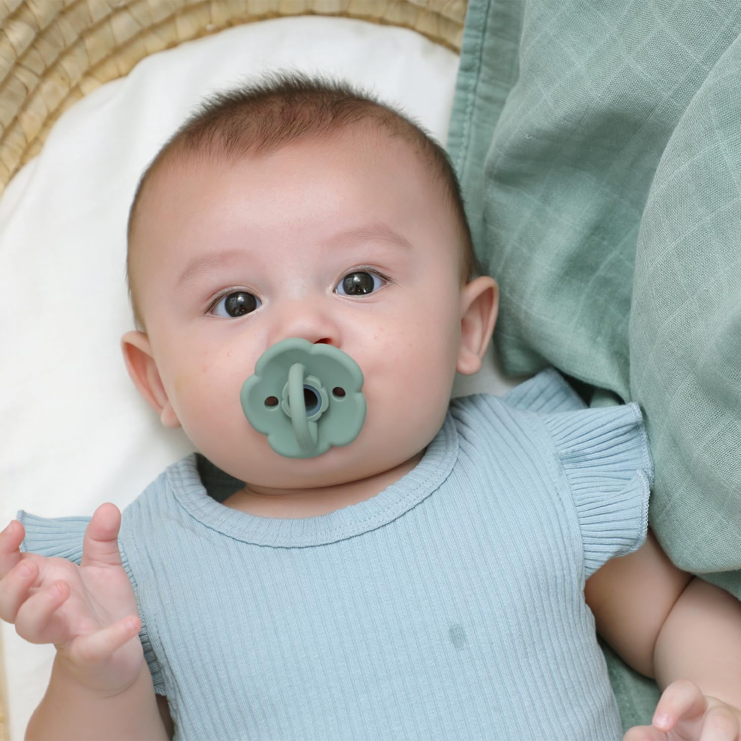 Moonkie Daisy pacifier with scalloped edges offers gentle soothing and style.