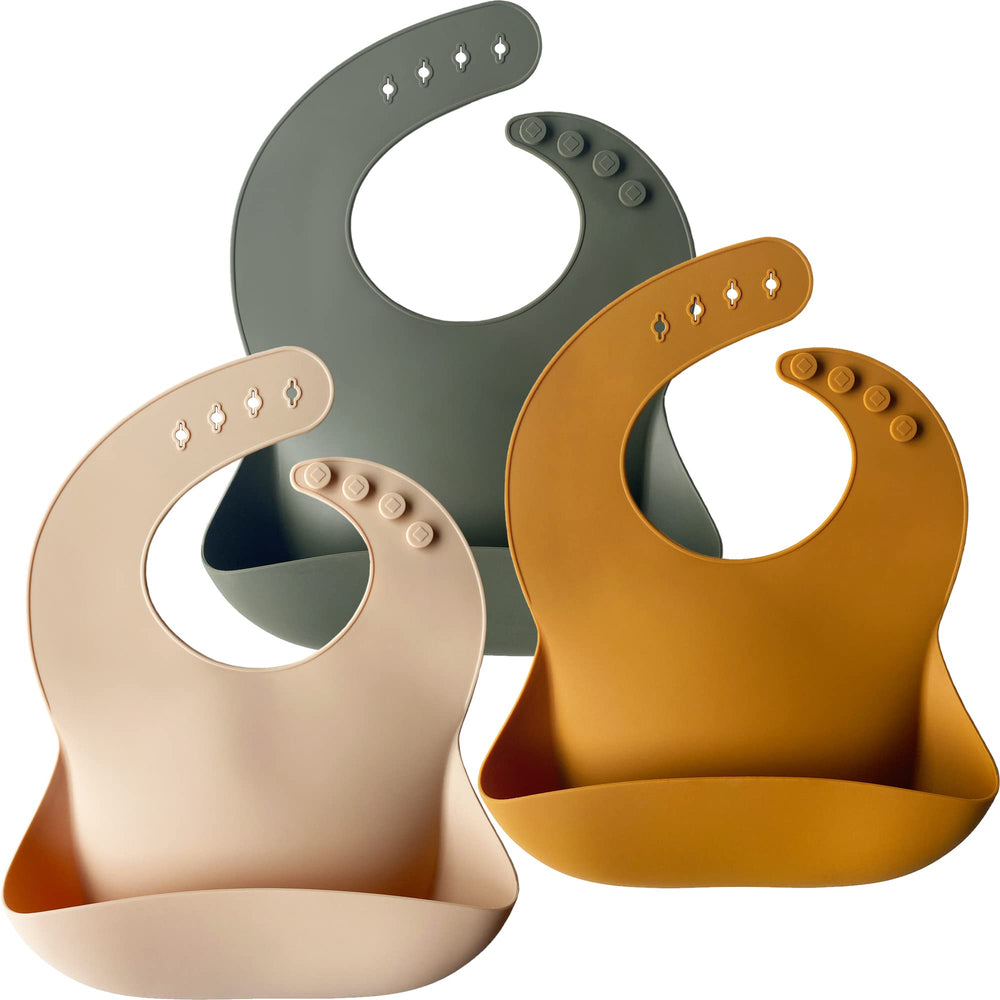 Moonkie silicone baby bib in cream front view, soft edges and easy mealtime catch.