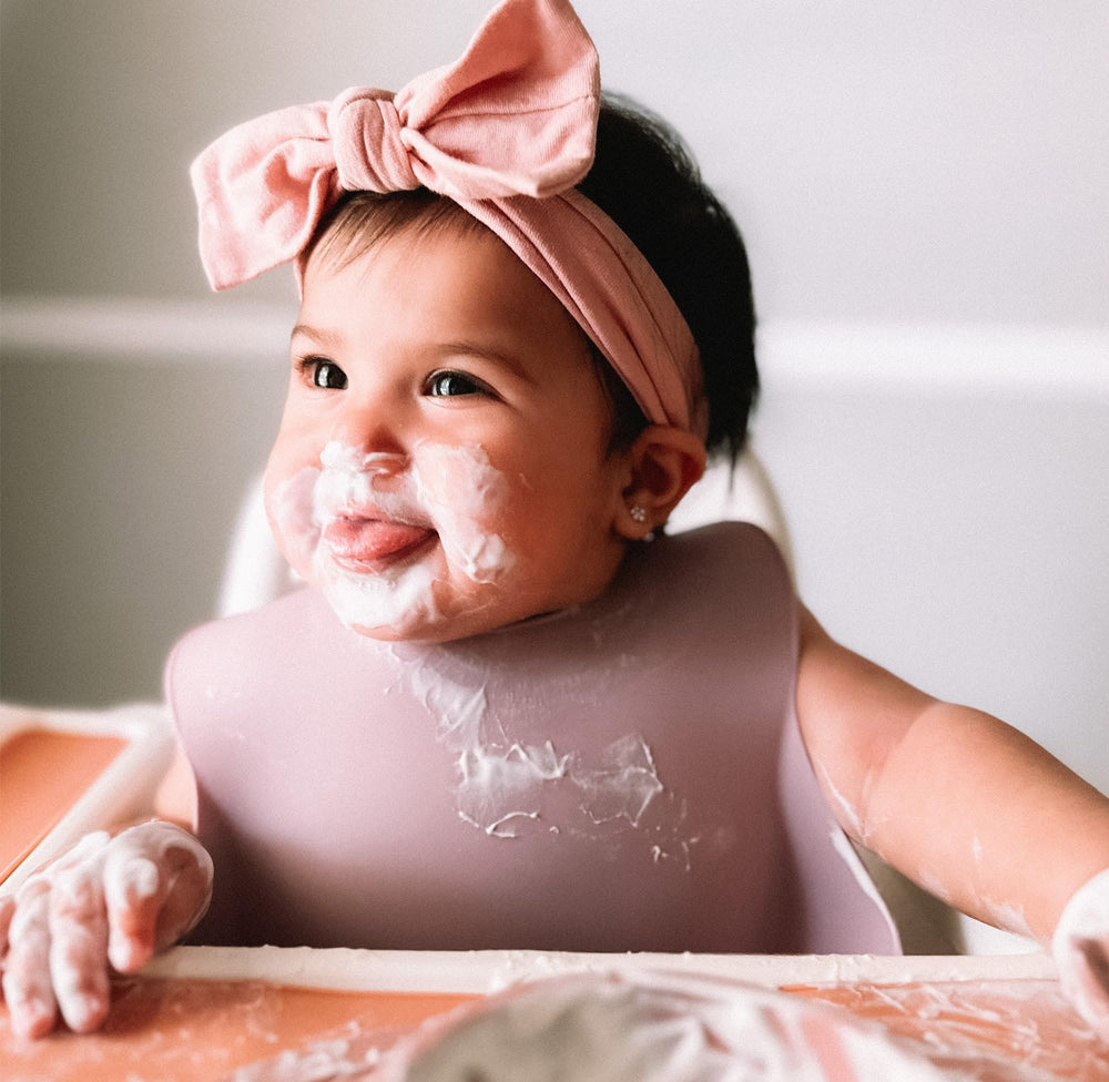 Moonkie dishwasher-safe bibs simplify post-meal cleanup.