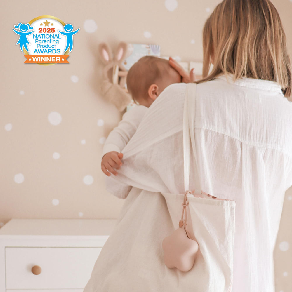Moonkie silicone pacifier holder case open, easy access to pacifiers during car rides and walks.