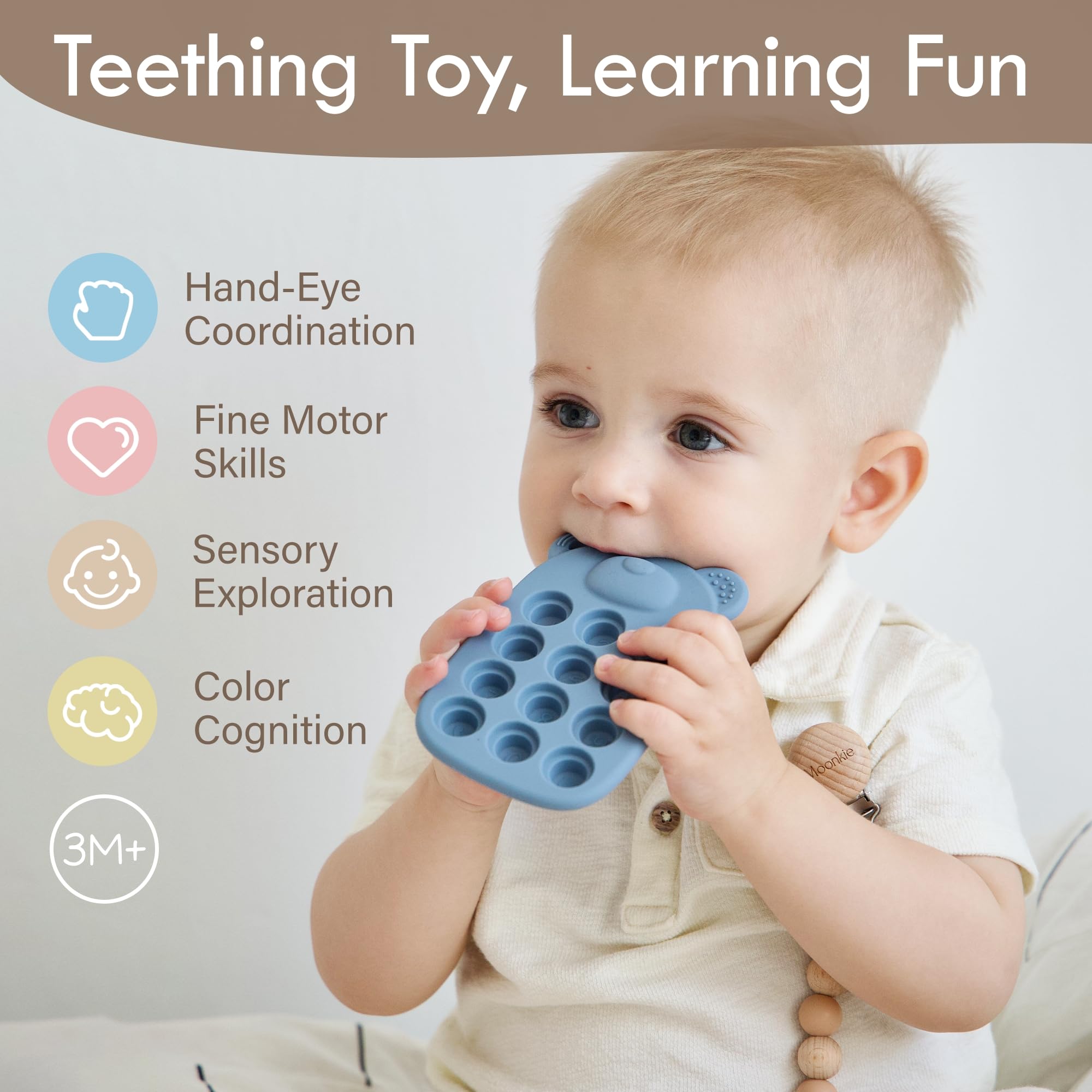 Moonkie teether back view with icons promoting early recognition during play
