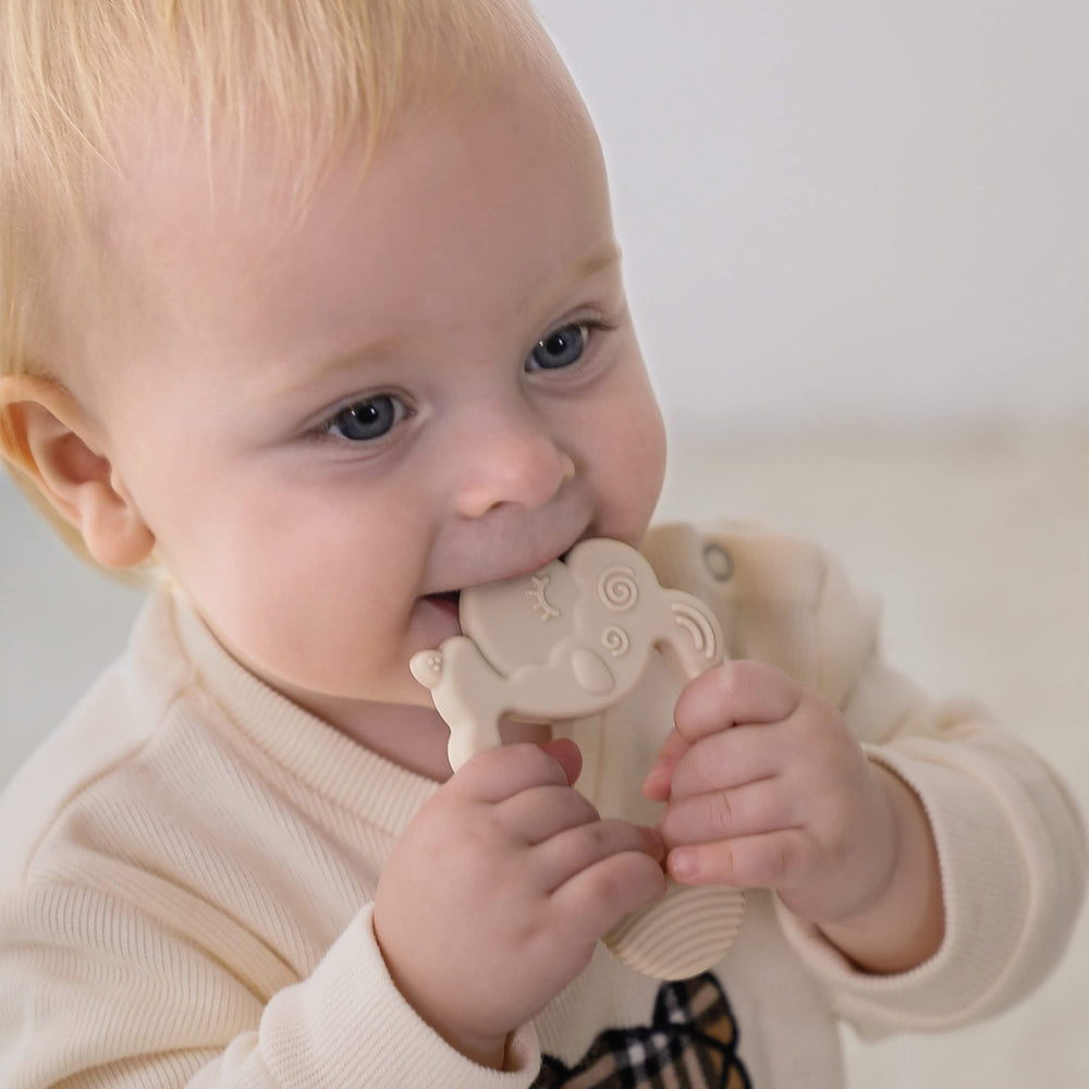 Moonkie Lamb teether with easy-grip design supports early hand coordination.