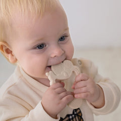 Moonkie Lamb teether with easy-grip design supports early hand coordination.