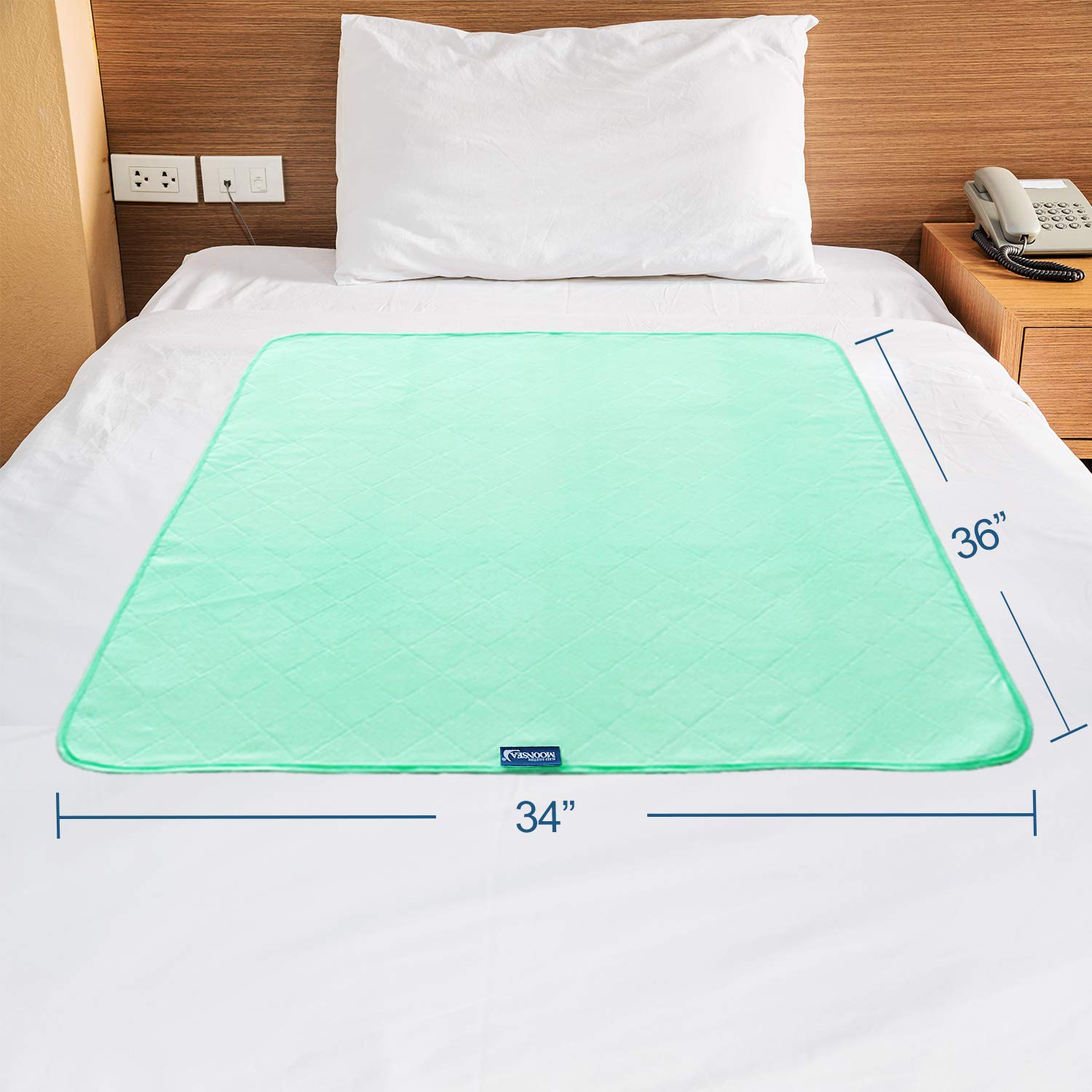 Moonsea bed pads used as pet pads beside a couch for easy cleanup