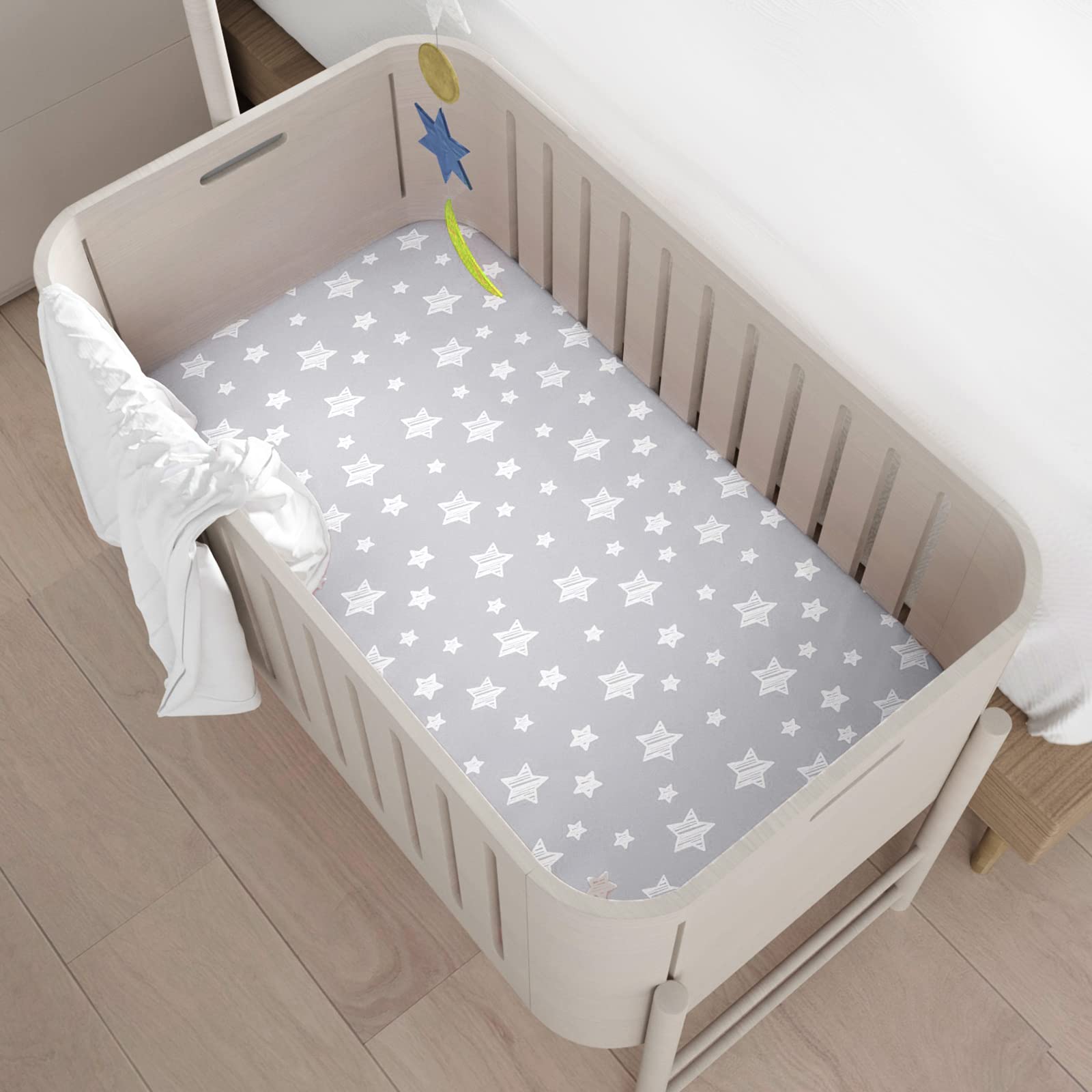 Moonsea mini crib sheets four-pack features colorful patterns for a cozy nursery.