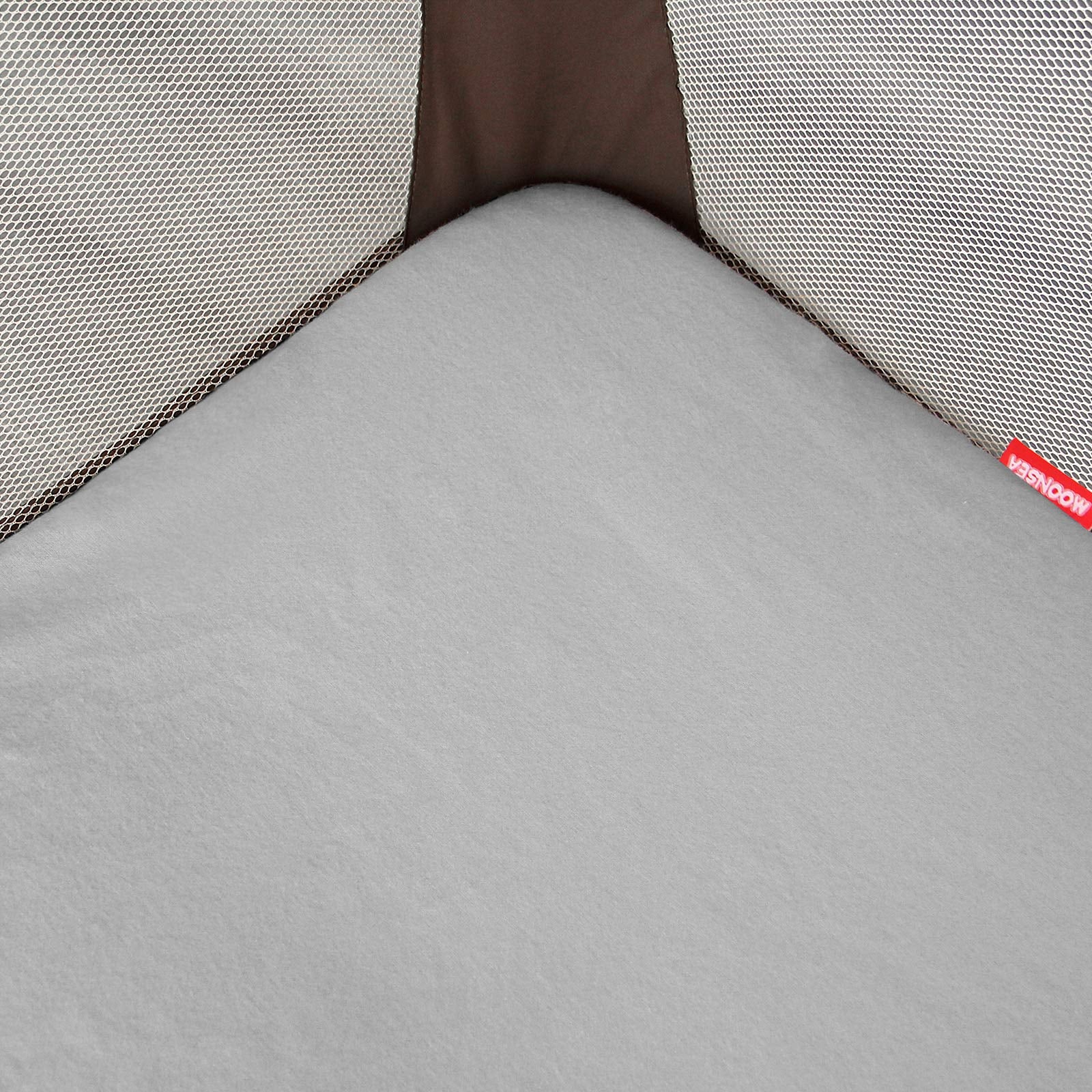 Moonsea sheet demonstrates quick install with elastic bottom for busy parents.