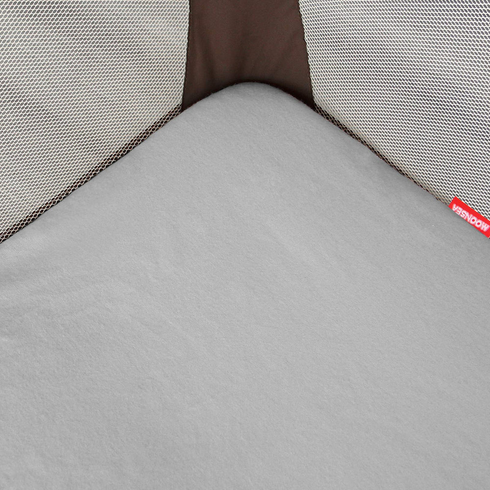 Moonsea sheet demonstrates quick install with elastic bottom for busy parents.