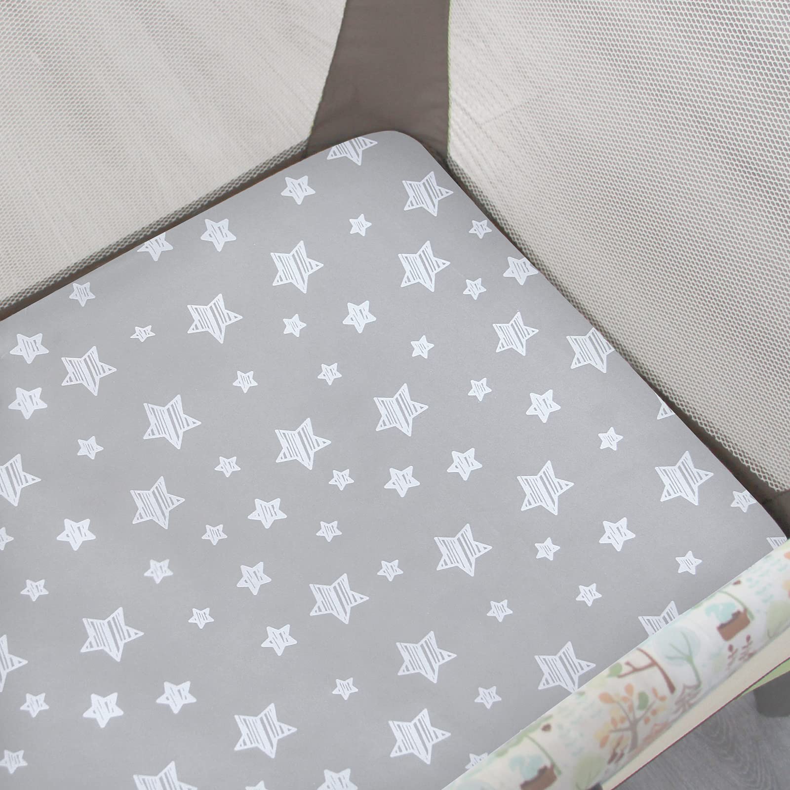 Moonsea sheet fitting snugly on a standard playard mattress