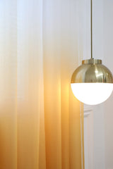MoonVAN Gradient Curtains in living room show translucent privacy with natural light.