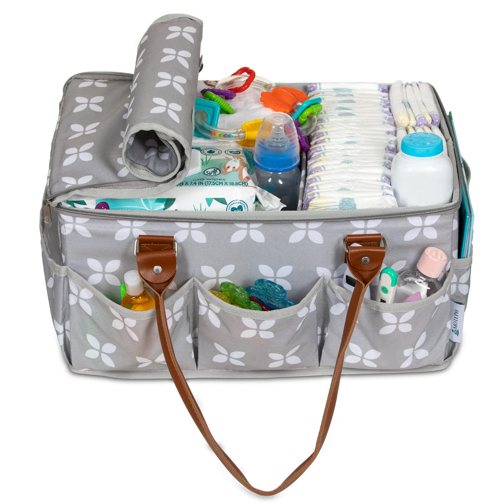 Moteph caddy beside crib used for diapers, wipes, and toys.