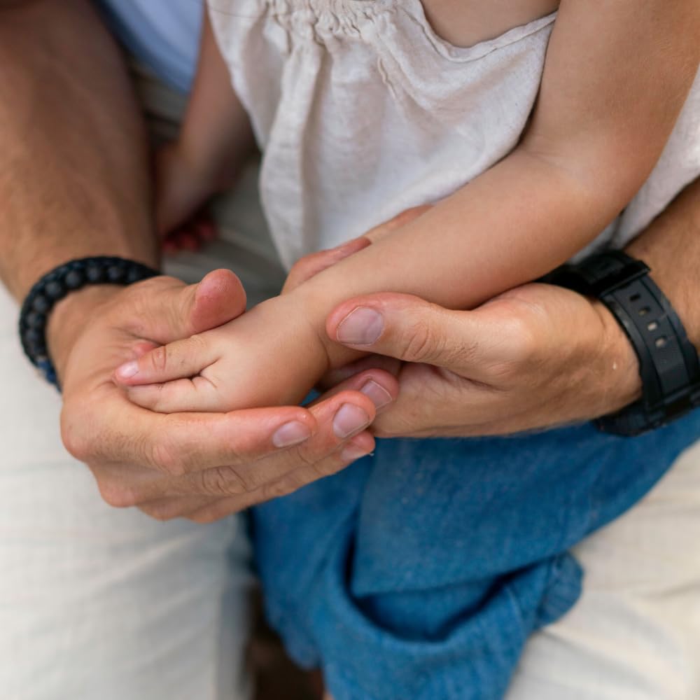 After-bath application of Everyday Baby Balm on a baby’s soft skin.