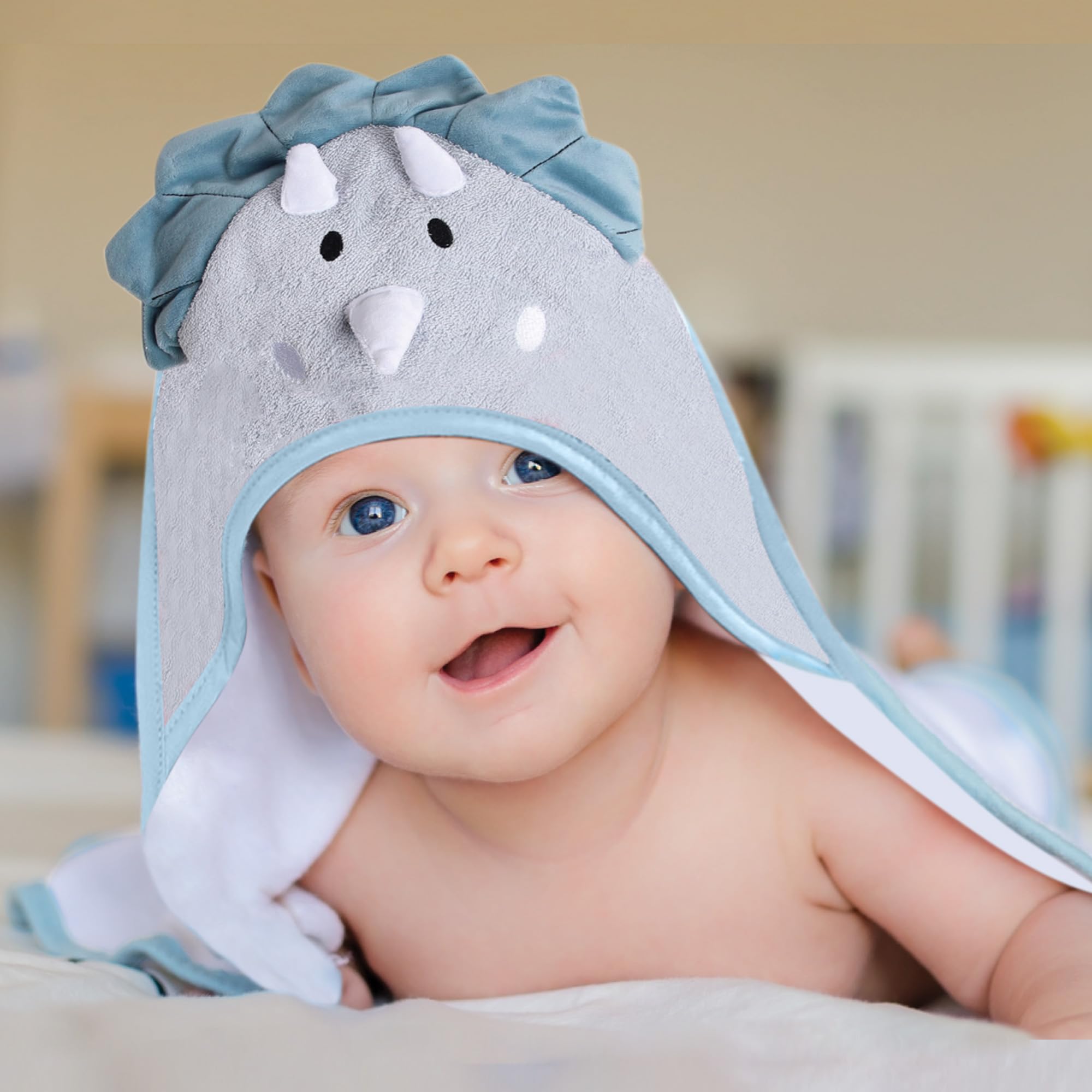 Young family using Mother's Choice dinosaur hood towel for drying