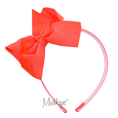 Motique Accessories neon headband with side bow in neon orange adds playful style for everyday wear.