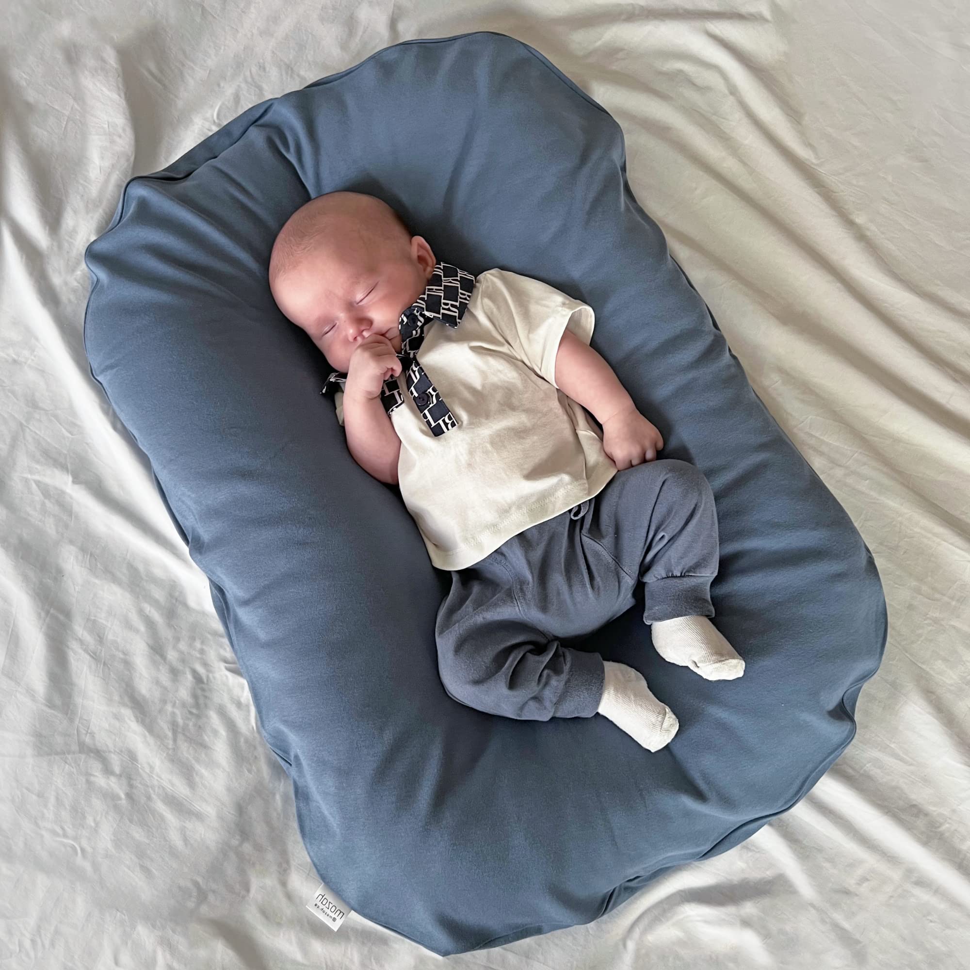 MOZAH slipcover designed for Snuggle Me loungers; easy swap for fresh, safe surfaces.