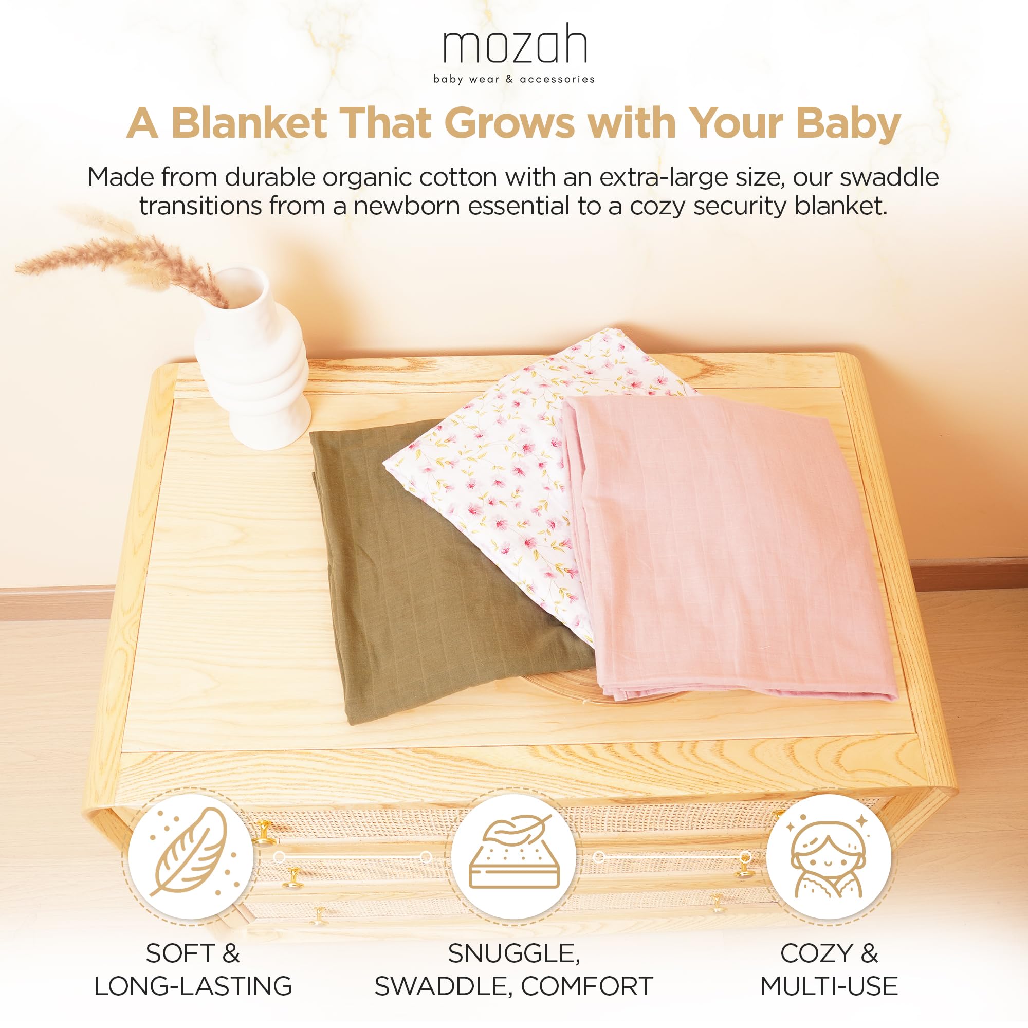 Mozah Organic Muslin Swaddle Blanket pink leaves, gentle texture for daytime naps.