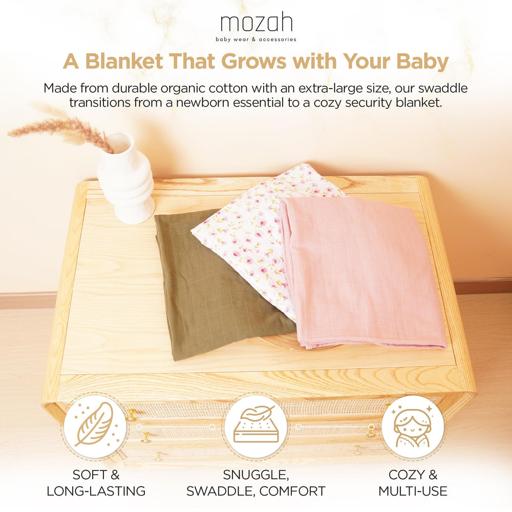 Mozah Organic Muslin Swaddle Blanket pink leaves, gentle texture for daytime naps.