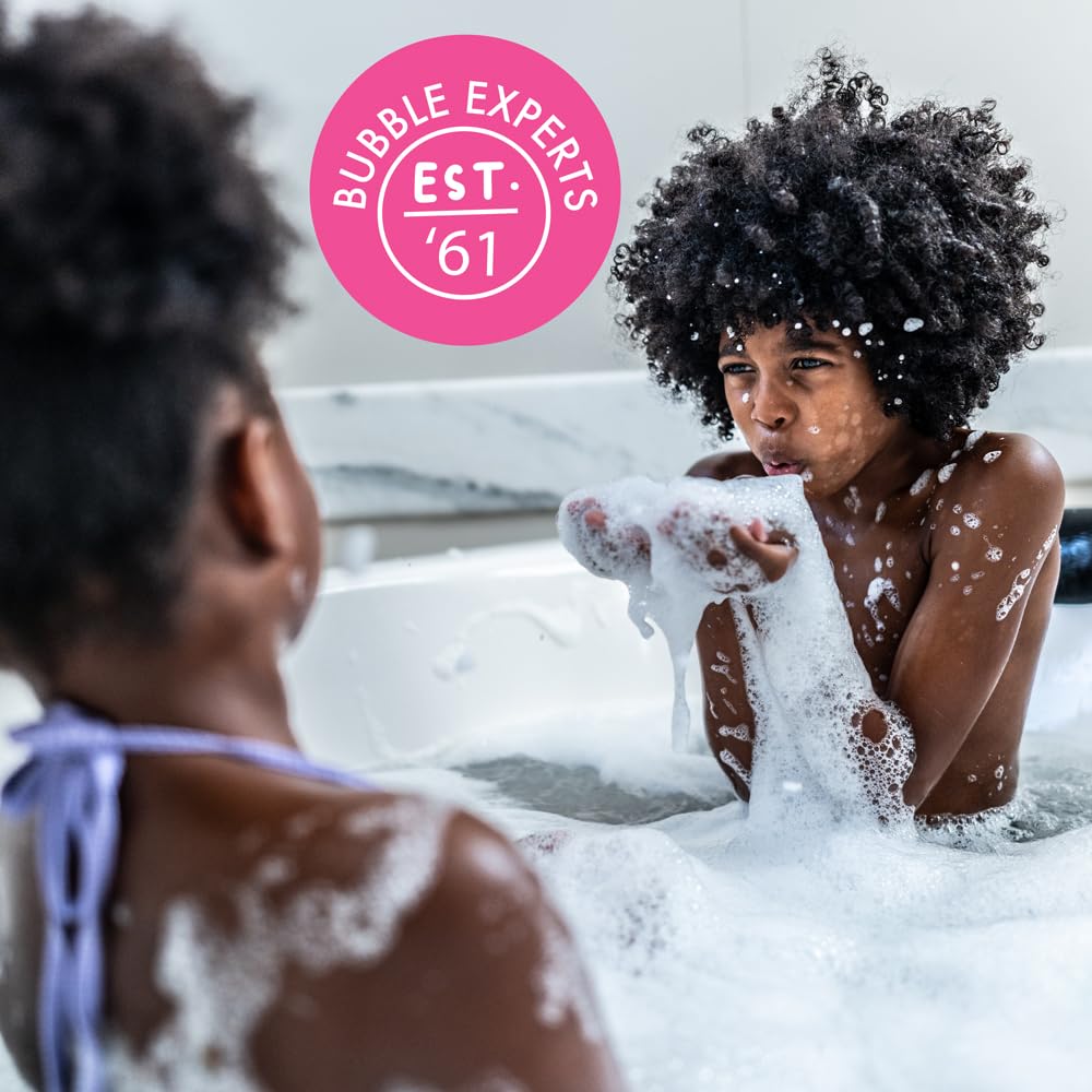 Bubbles rise around a child during a Mr. Bubble bath.