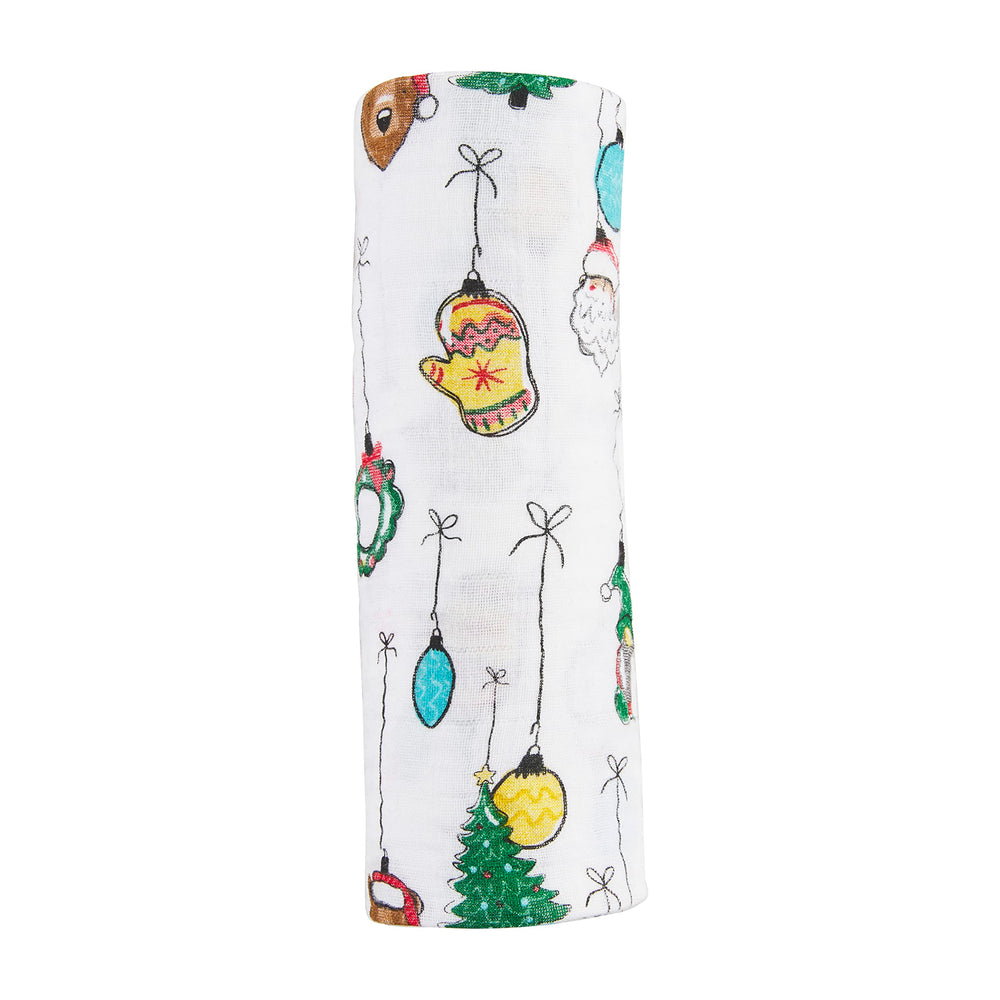 Mud Pie baby swaddle blanket with white Christmas ornament pattern; soft and breathable for newborns.