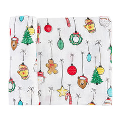 Mud Pie swaddle blanket featuring festive white ornaments; gentle on skin and machine washable.
