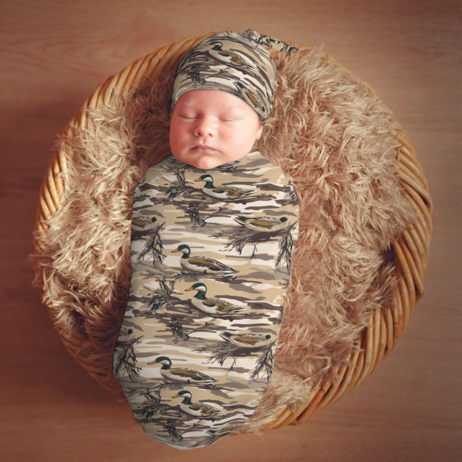 Muishi duck camouflage swaddle used as a newborn photo prop.