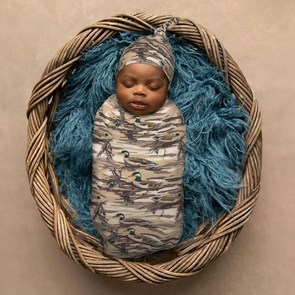 Muishi duck camouflage swaddle designed for 0-6 month babies showcases versatile use.