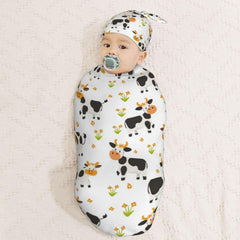 Muishi Farm milk cow oval-swaddle wrap creates a cocoon-like snug fit