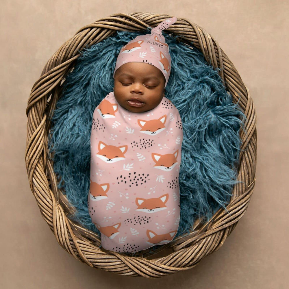 Muishi fox pink swaddle prepared for newborn photography session